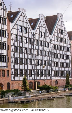Gdansk, Poland May 2022, Modern Buildings On Granary Island Over The Motlawa River In Old Town. Tour