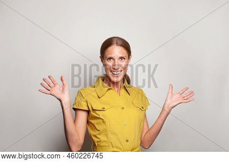 Stylish Emotiona Smiling Surprised Woman Standing With Hand Up Gesture. Human Emotions, Facial Expre