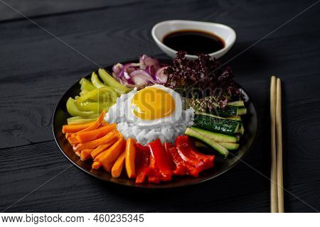 Close-up Of A Korean Dish, With A Variety Of Appetizers With Vegetables And Eggs. Diet. Bibimbap. To