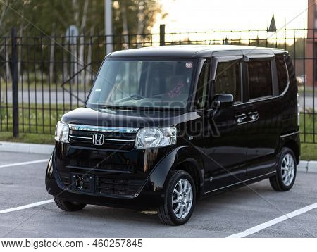 Novosibirsk, Russia -   August 03, 2022:   Black Honda N-box,  Is Parked  On The Street On A Warm Su