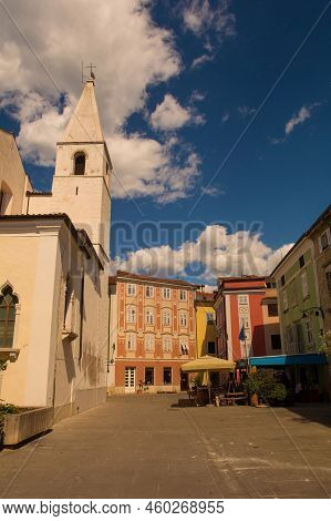 A Quiet Square In The Historic Centre Of Izola On The Coast Of Slovenia. The Church Of Saint Marije 
