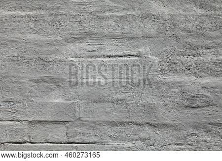 Grey Wall, Texture, Background. The Building Wall, Painted With Whiting. Wavy And Bumpy Surface. Gra