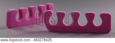 Close-up Of Pink Toe Separators, Pair Of Equipment For Pedicure Procedure. Cute Bright Cosmetic Tool