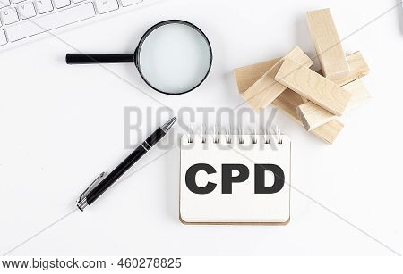 Cpd Word Written On A Notebook With Block Magnifier And Pen , Business Concept.