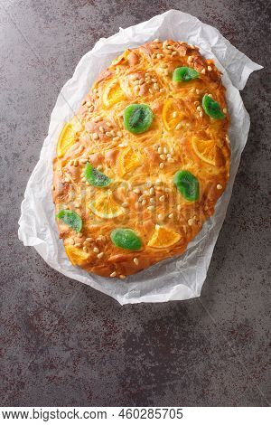 St Johns Cake Coca De Sant Joan With Pine Nuts, Candied Fruit Closeup On The Paper On The Table. Ver