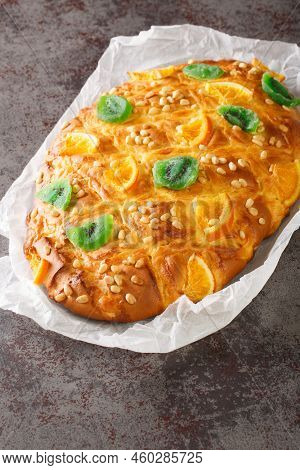St Johns Cake Coca De Sant Joan With Pine Nuts, Candied Fruit Closeup On The Paper On The Table. Ver