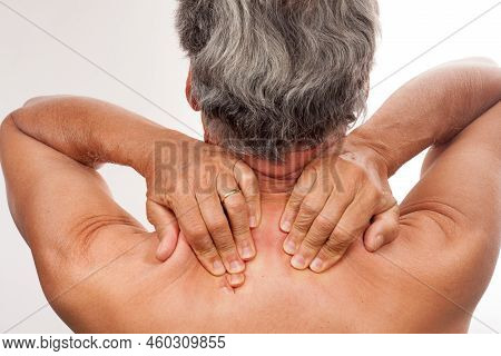 Mature Man 60plus Massaging His Trapeze Muscles For Pain Relief