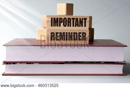 Important Reminder - Words On Wooden Blocks On The Background Of Books. Info Concept