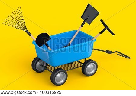 Garden Wheelbarrow With Garden Tools Like Shovel, Rake And Fork On Yellow Background. Handcart Or Ca