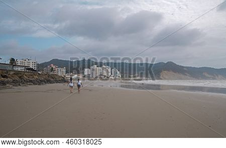 Bahia De Caraquez, Manabi / Ecuador - August 19 2022: Couple Of Women Walking On The Beach Next To T