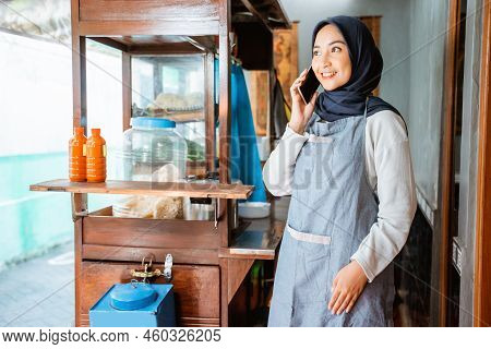 Woman In A Veil Makes A Cell Phone Call