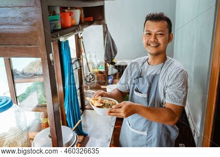 Man Seller Smiling Brought A Bowl Of Chicken Noodles