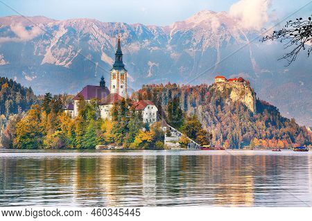 Astonishing Sunset View Of Popular Tourist Destination  Bled Lake. Dramatic View Of Pilgrimage Churc