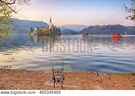 Stunning Sunset View Of Popular Tourist Destination  Bled Lake. Dramatic View Of Pilgrimage Church O