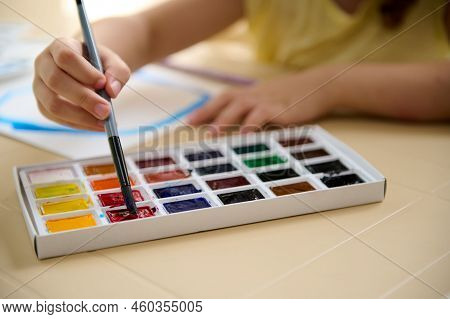 Details: Small Hand Of A Talented Cute Child, Holding Paintbrush And Mixing Colorful Paints On A Pro