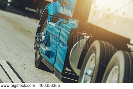 American Road Transportation Industry. Blue Semi Truck On A Interstate Highway Close Up. Ground Ship
