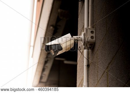 Close Up Of Facade Garage Entrance With Mounted Surveillance Camera Ccd Video Monitoring And Securit