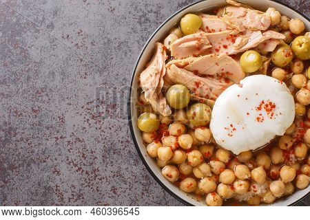 Traditional Tunisian Chickpea Soup Served For Breakfast Lablabi With A Poached Egg And Tuna Closeup 