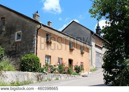 Row Of Old Large Suburban Family Houses With Partially Renovated Dirty Dilapidated Facade And Fresh 