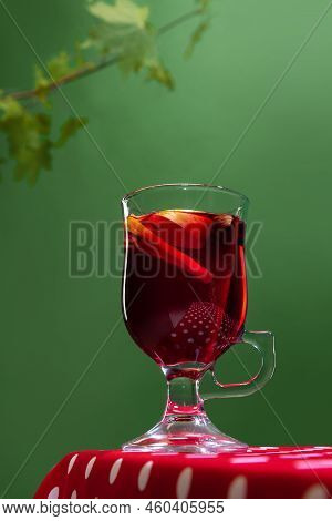Glass With Delicious Aromatic Cocktail, Mulled Wine With Orange Slice And Cinnamon Stick Isolated Ov