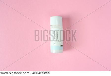 Kyiv, Ukraine - 19 August 2022: Travel Size White Mini Bottle Korean Skin Care Cosmetics Lotion Of B