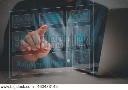 Man Hand Using Laptop To Working Technology.hand Toucing Virtual Screen Graph And Chart Data Analysi