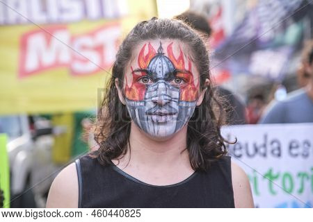 Buenos Aires, Argentina; August 25, 2022: Young Woman Who Has Painted On Her Face The Building Of Th