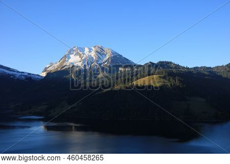 Snow Capped Mount Fluebrig At Sunrise. Scene In Schwyz Canton.
