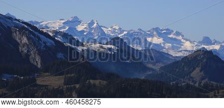 Distant View Of Mount Uri Rotstock And Other Snow Capped Mountains.