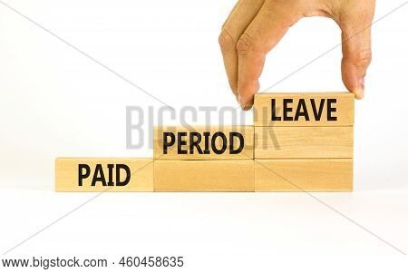 Paid Period Leave Symbol. Concept Words Paid Period Leave On Wooden Blocks. Beautiful White Table Wh