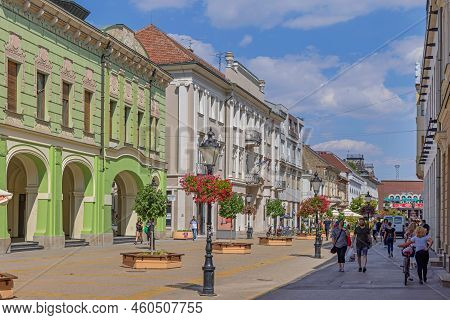 Subotica, Serbia - August 01, 2022: People Walking At Promenade Korzo Street Hot Sunny Summer Day.
