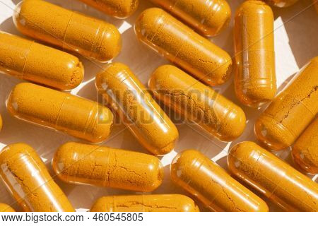 Turmeric Plus Black Pepper Extract Gelatin Capsule Close Up Top View. Herbal Supplement Organic Curc