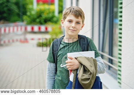 Happy Preteen Kid Boy With Backpack Or Satchel. Schoolkid In On The Way To Elementary Or Middle Scho