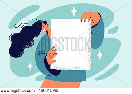 Smiling Young Woman Show White Empty Paper For Advertising Placement. Happy Girl Demonstrate Mockup 