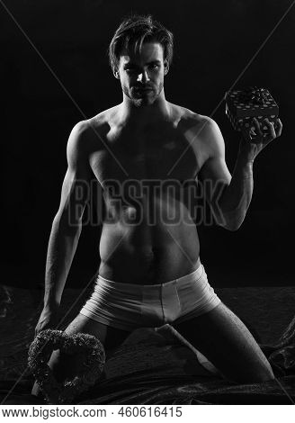 Be My Valentine. Sexual Health And Libido. Desire And Erotic Games. Man Hold Gift Box. Sexy And Sens