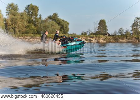 Pripyat, Belarus - Couple Riding A Speedy Jet Ski And Enjoying At The Pripyat River In Belarus In Ju