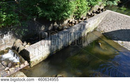 Turbid Water During The Flood Falls From Large Dams And Forms A Lot Of Foam. Fish Pass Is A Neutrali