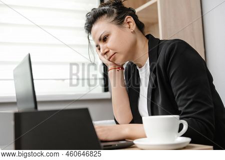 A Girl Office Worker Is Bored At Her Boring Job. Tired Employee. Boring Life In The Office