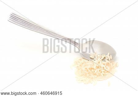 Silver Spoon And Handful Of Rice Isolated On A White Background.