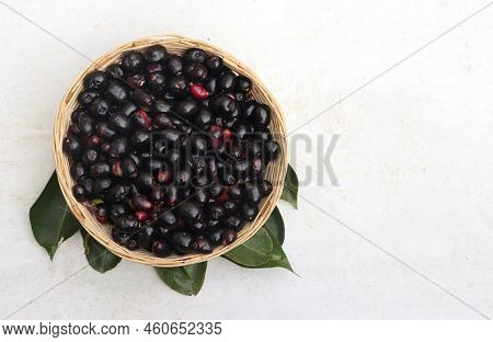 Top View Of Jamun Or Black Plum Fruit A Bamboo Basket With Leaves Isolated On White Background With 