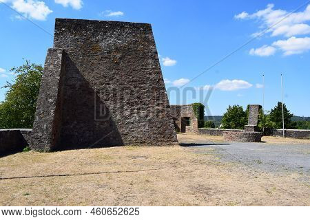 Castle Ruin Courtyard With Dry Grass Between Think Stone Walls