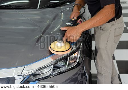 Car Detailing - Male Mechanic Holding Car Polishing Machine. Auto Industry, Car Polishing And Painti