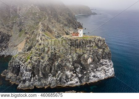 An Old Ruined Lighthouse On Askold Island In The East Sea. A Beautiful Ruined Staircase Leading To T