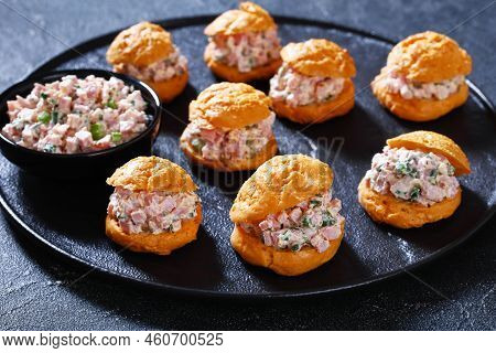 Ham Salad Serving It Sandwiched Between Airy Gougeres, Cheese Puffs On Black Stone Tray