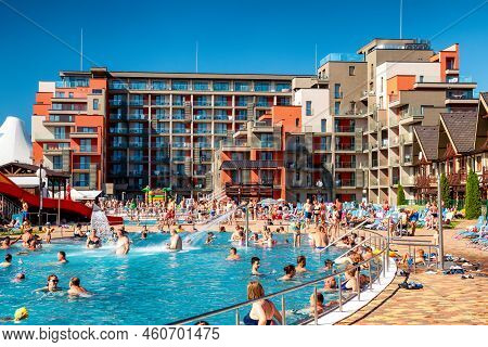Besenova, Slovakia - July 25, 2022: People Relaxing In Pool At Waterpark During Summer Hot Day In Vi