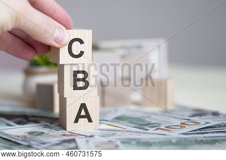 Hand Holding Wood Cube Block With Cba Text Business Concept