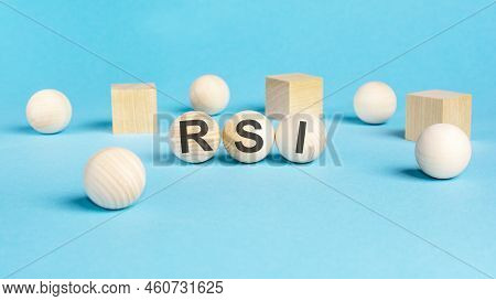 Concept Text 'rsi' On Wooden Spheras On A Beautiful Blue Background. Business Concept. Copy Space. R