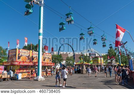 Calgary, Alberta, Canada - July 15, 2022: People Enjoy The Calgary Stampede At The Stampede Park In 
