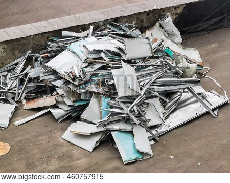 A Pile Of Aluminum Scrap. Construction Debris Piled Up. Garbage From Non-ferrous Metals.