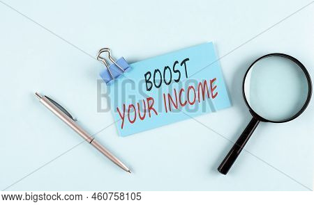 Boost Your Income Text Written On Sticky With Magnifier And Pen, Business Concept